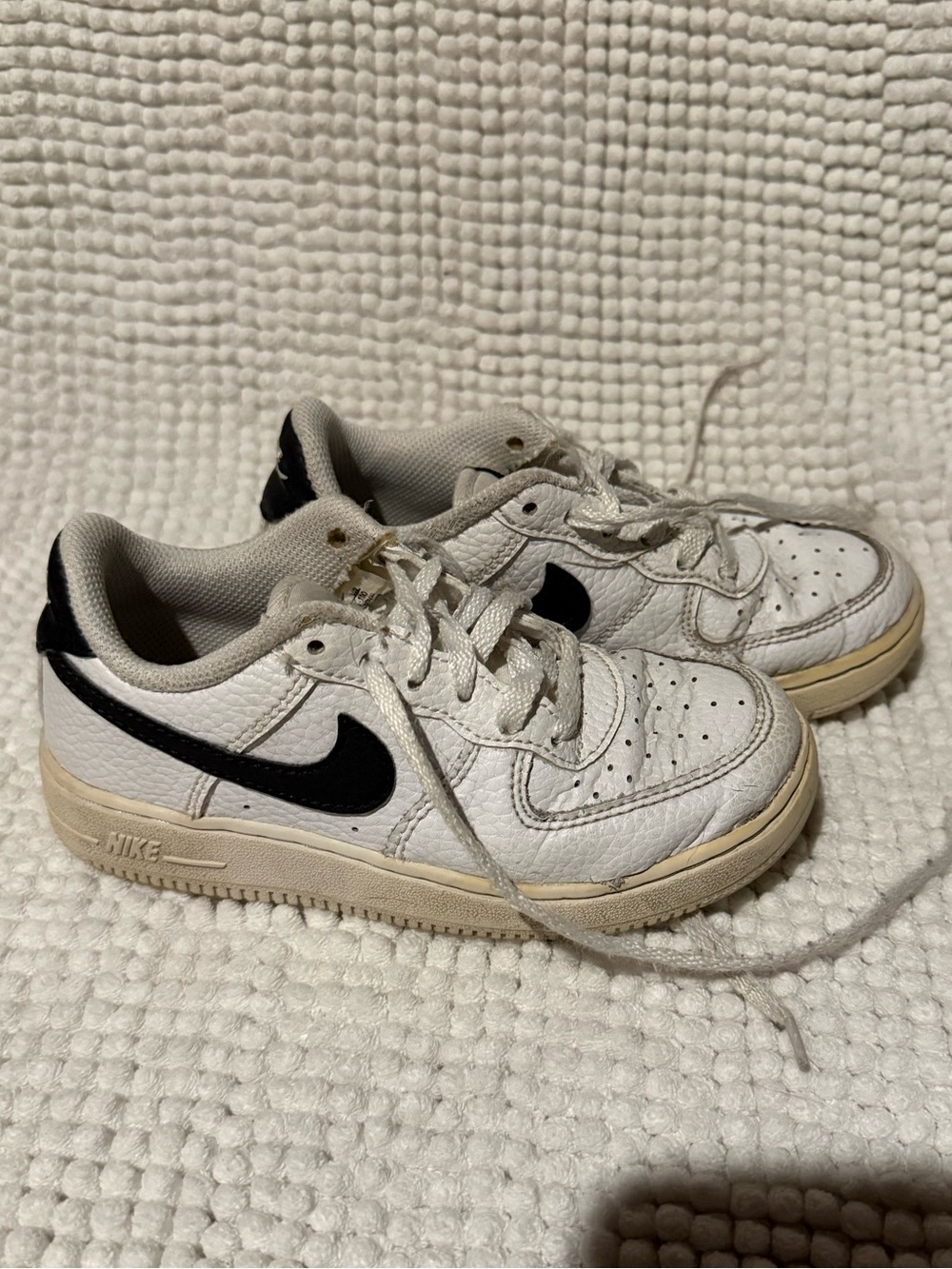 Nike Kids White Sneakers with Black Swoosh